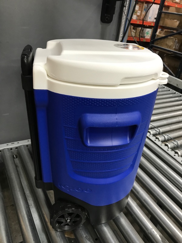 Photo 1 of Igloo 5 Gallon Wheeled Portable Sports Cooler Water Beverage Dispenser with Flat Seat Lid, Blue, Model Number: 42256 Majestic Blue 5 Gallon