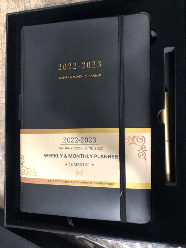 Photo 2 of Modern Mercantile Planner 2022-2023 - 5.8" x 8.3" Jan 2022 - June 2023 Monthly Planner with Weekly and Monthly Planning, Faux Leather Hard Cover, Gold Pen, Book Case, Bookmark and Elastic Band Black