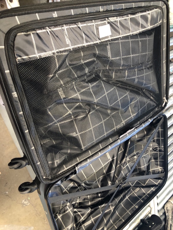 Photo 3 of **MINOR WEAR FROM USE**    American Tourister Moonlight Hardside Expandable Luggage with Spinner Wheels, Silver, Checked-Large 28-Inch