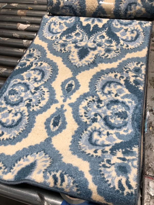 Photo 1 of 2' X 6' BLUE/WHITE CARPET