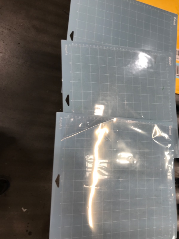 Photo 2 of **USED**  Cricut LightGrip Cutting Mats 12in x 12in, Reusable Cutting Mats for Crafts with Protective Film, Use with Printer Paper, Vellum, Light Cardstock & More for Cricut Explore & Maker (3 Count) LightGrip 12"x12"