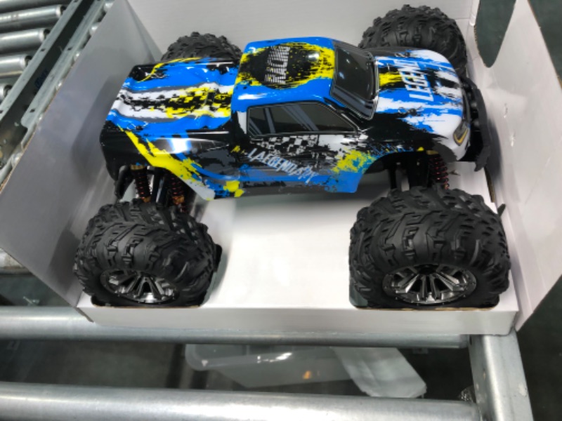 Photo 4 of LAEGENDARY Fast RC Cars for Adults and Kids - 4x4, Off-Road Remote Control Car - Battery-Powered, Hobby Grade, Waterproof Monster RC Truck - Toys and Gifts for Boys, Girls and Teens Blue - Yellow Blue Yellow Up to 31 mph