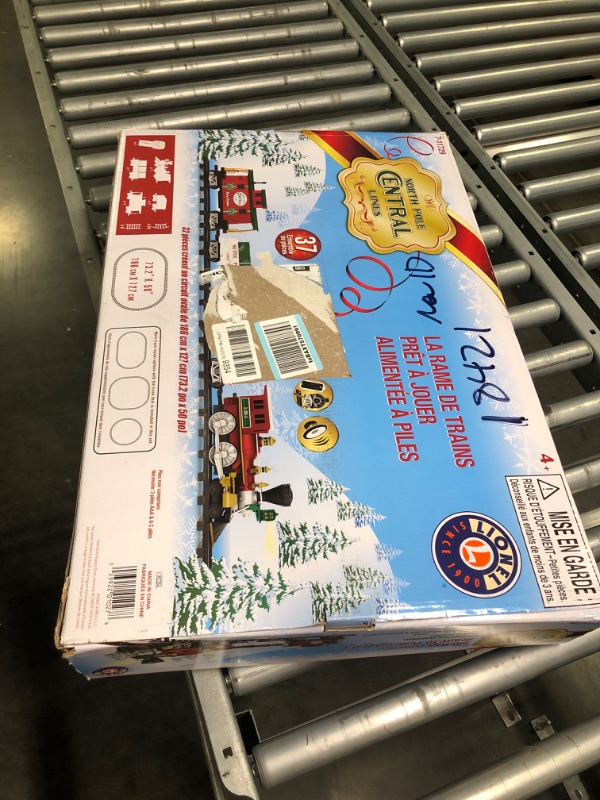 Photo 1 of Lionel North Pole Central Battery-Powered Train Set with Remote + Inner Loop Track Expansion Pack Complete Set + Expansion Track (Inner Loop)