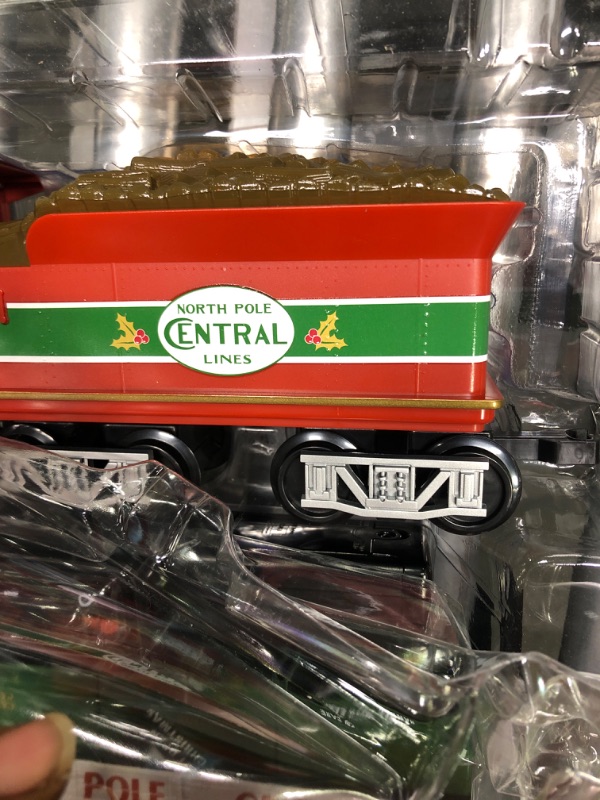 Photo 1 of Lionel North Pole Central Battery-Powered Train Set with Remote + Inner Loop Track Expansion Pack Complete Set + Expansion Track (Inner Loop)