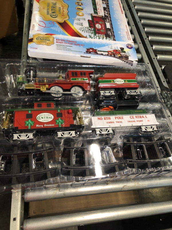 Photo 1 of Lionel North Pole Central Battery-Powered Train Set with Remote + Inner Loop Track Expansion Pack Complete Set + Expansion Track (Inner Loop)