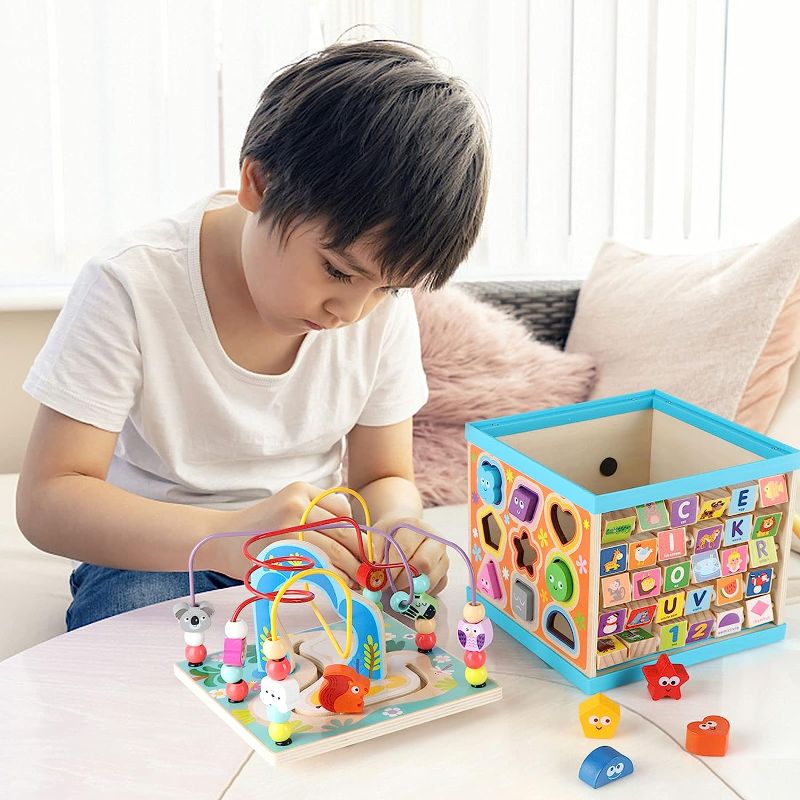 Photo 1 of 
Qilay Wooden Baby Activity Cube for 1 2 3 Year Old Kids(Large), 5 in 1 Multipurpose ABC-123 Abacus Bead Maze Shape Sorter | Early Educational Toy for Toddlers - First Birthday Gifts for Boys GirlsQilay Wooden Baby Activity Cube for 1 2 3 Year Old Kids(La