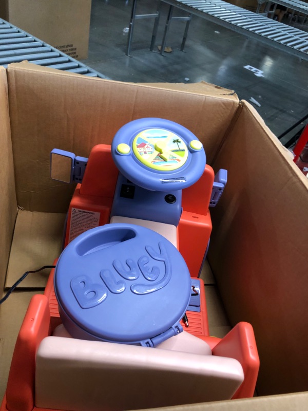 Photo 5 of 
Bluey 6V Ride On Car for Toddlers - Interactive Electric Car for Kids with Sound Effects & Music, Riding Toy for Boys & Girls, Includes 6V Rechargeable Battery & Charger, LargeBluey 6V Ride On Car for Toddlers - Interactive Electric Car for Kids with Sou