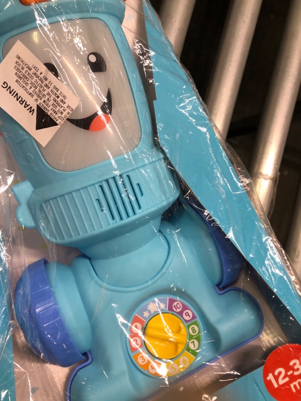 Photo 3 of Fisher-Price Laugh & Learn Toddler Toy Vacuum, Push Toy with Lights Music and Educational Songs, Light-Up Learning