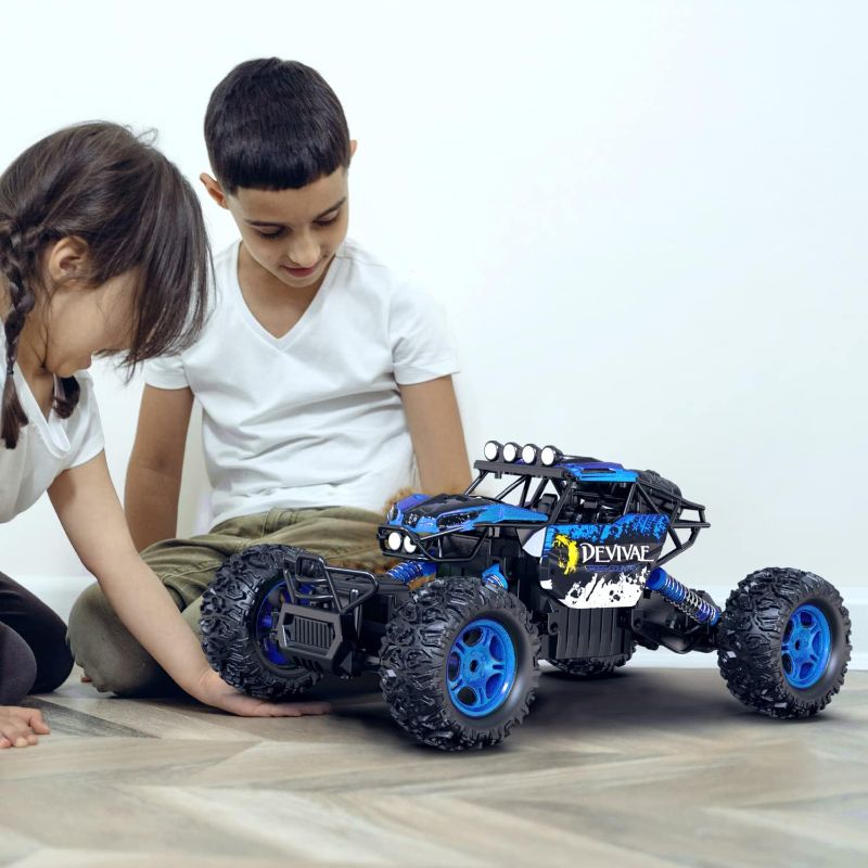 Photo 1 of CROBOLL 1:12 Large Remote Control Car for Boys Kids with Lifting Function,4WD RC Cars Electric Monster Truck Toy Gifts 4X4 Off-Road RC Rock Crawler 2.4GHz All Terrain RC Truck with 2 Batteries(Blue)