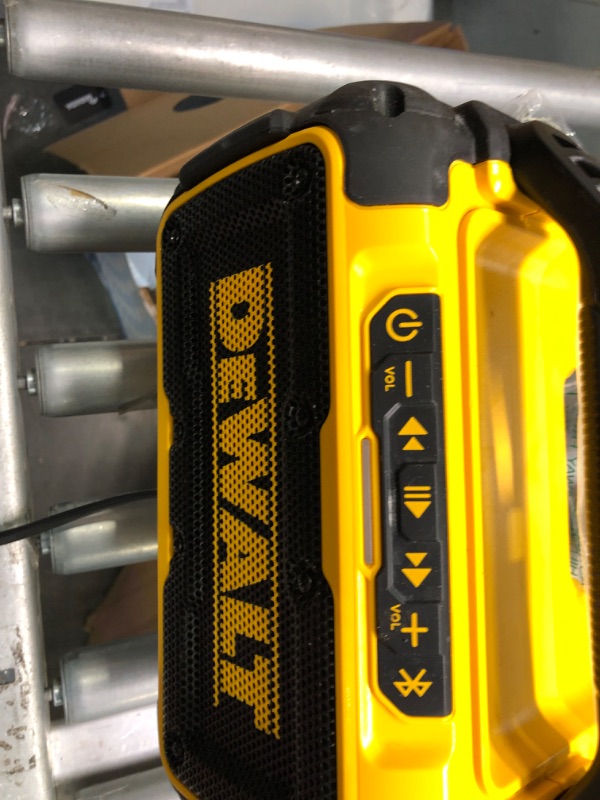 Photo 2 of DEWALT 20V MAX Bluetooth Speaker, 100 ft Range, Durable for Jobsites, Phone Holder Included, Lasts 8-10 Hours with Single Charge (DCR010), Yellow/Black