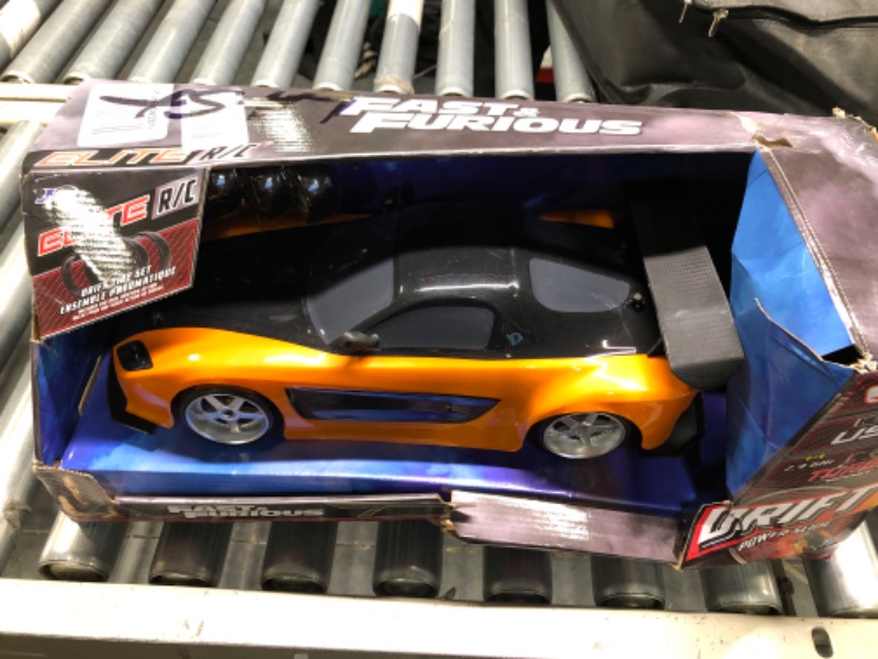 Photo 2 of Jada Toys Fast & Furious Han’s Mazda RX-7 Drift RC Car, 1: 10 Scale 2.4Ghz Remote Control Orange & Black, Ready to Run, USB Charging (Standard) (99700)