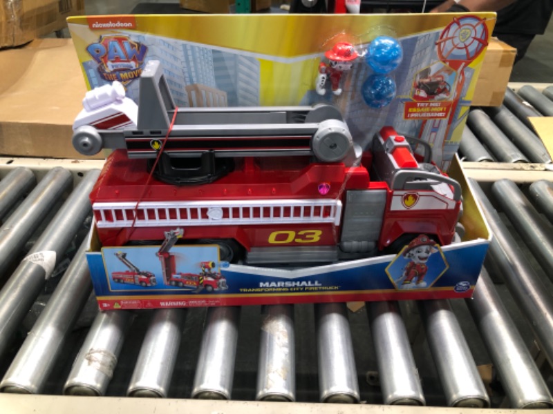 Photo 2 of Paw Patrol, Marshall’s Transforming Movie City Fire Truck with Extending Ladder, Lights, Sounds and Action Figure, Kids Toys for Ages 3 and up