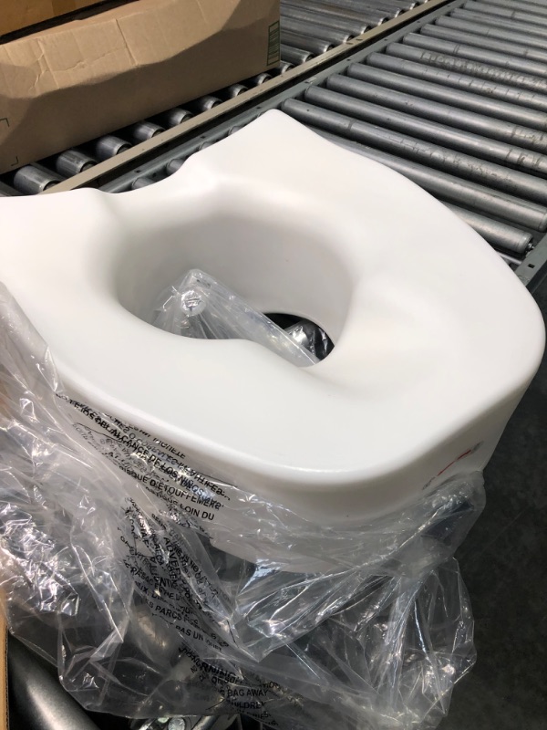 Photo 1 of Drive Medical Premium Plastic Raised Toilet Seat with Lock and Padded Armrests, Elongated, Pack of 1