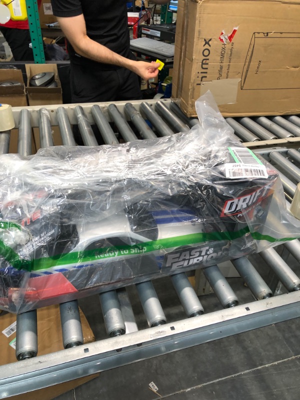 Photo 1 of Jada Toys Fast & Furious Brian's Nissan Skyline GT-R (BN34) Drift Power Slide RC Radio Remote Control Toy Race Car with Extra Tires, 1:10 Scale, Silver/Blue (99701)
