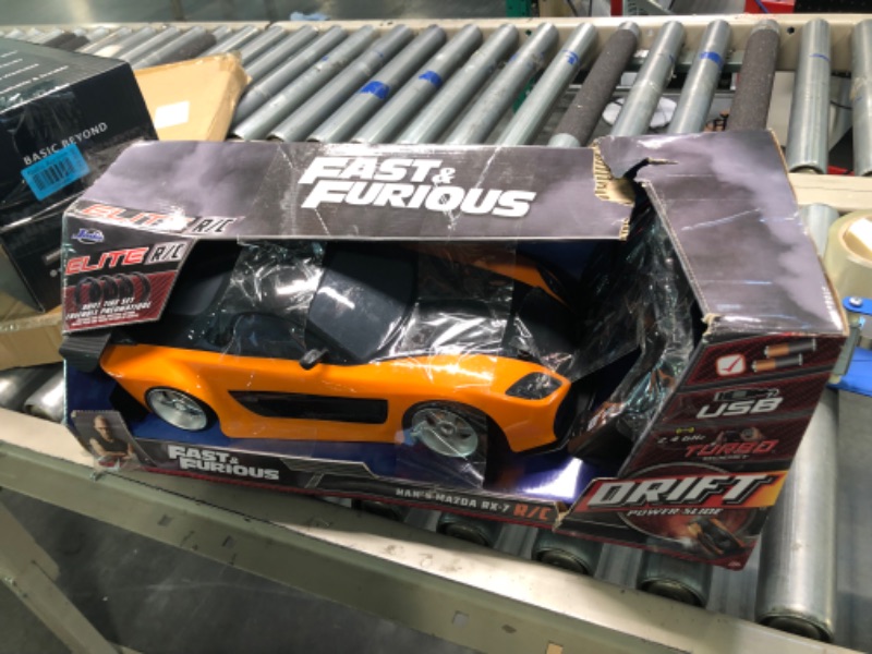 Photo 2 of Jada Toys Fast & Furious Han’s Mazda RX-7 Drift RC Car, 1: 10 Scale 2.4Ghz Remote Control Orange & Black, Ready to Run, USB Charging (Standard) (99700)