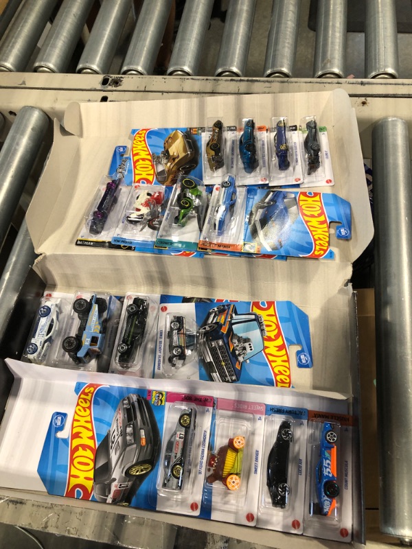 Photo 3 of Hot Wheels Basics Black Box, 16 First-Appearance Toy Cars in 1:64 Scale, Possibly Includes a Treasure Hunt Car, Toy for Collectors & Kids 3 Years Old & Older Box I