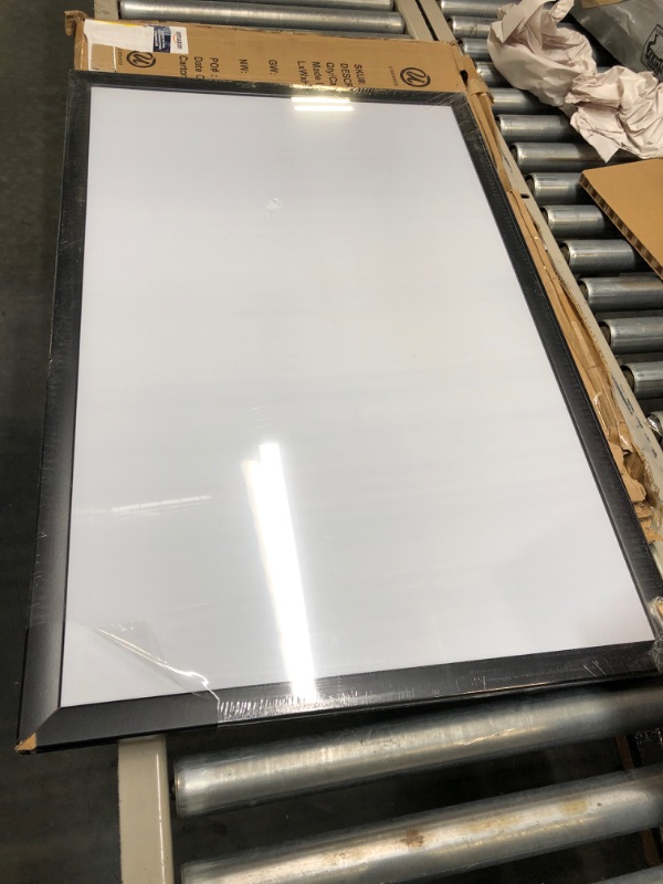 Photo 1 of Amazon Basics Magnetic Dry Erase White Board, 35 x 23-Inch Whiteboard - Black Wooden Frame 23"x35" Magnetic, Wood Frame
