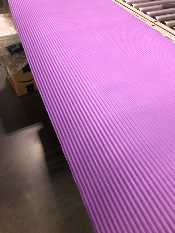 Photo 3 of Amazon Basics Extra Thick Exercise Yoga Gym Floor Mat with Carrying Strap - 74 x 24 x .5 Inches, Purple & High-Density Round Foam Roller for Exercise and Recovery - 36 Inch, Black