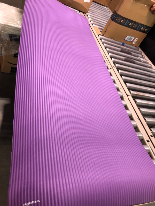 Photo 3 of Amazon Basics Extra Thick Exercise Yoga Gym Floor Mat with Carrying Strap - 74 x 24 x .5 Inches, Purple & High-Density Round Foam Roller for Exercise and Recovery - 36 Inch, Black