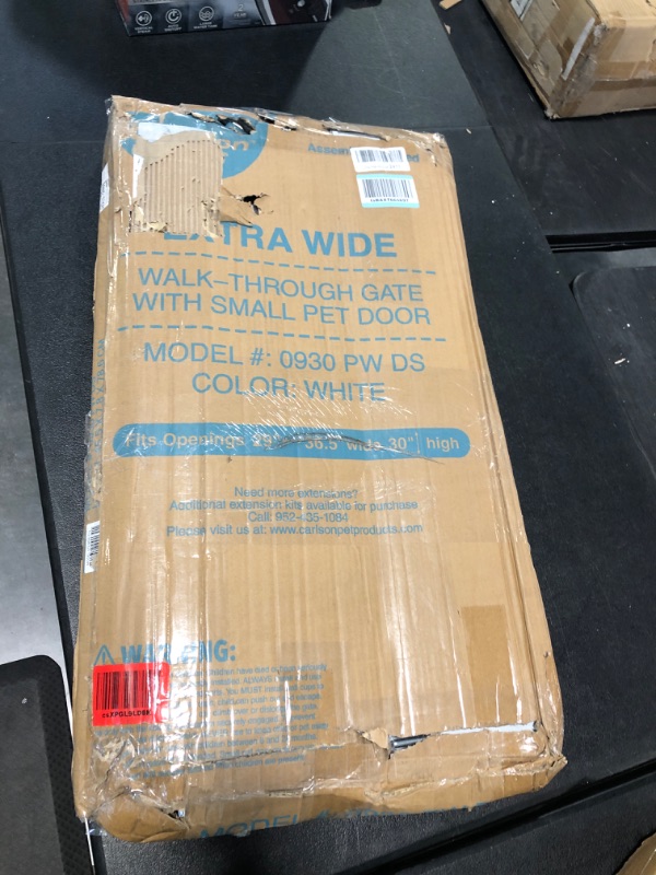 Photo 2 of Carlson Extra Wide Walk Through Pet Gate with Small Pet Door, Includes 4-Inch Extension Kit, Pressure Mount Kit and Wall Mount Kit