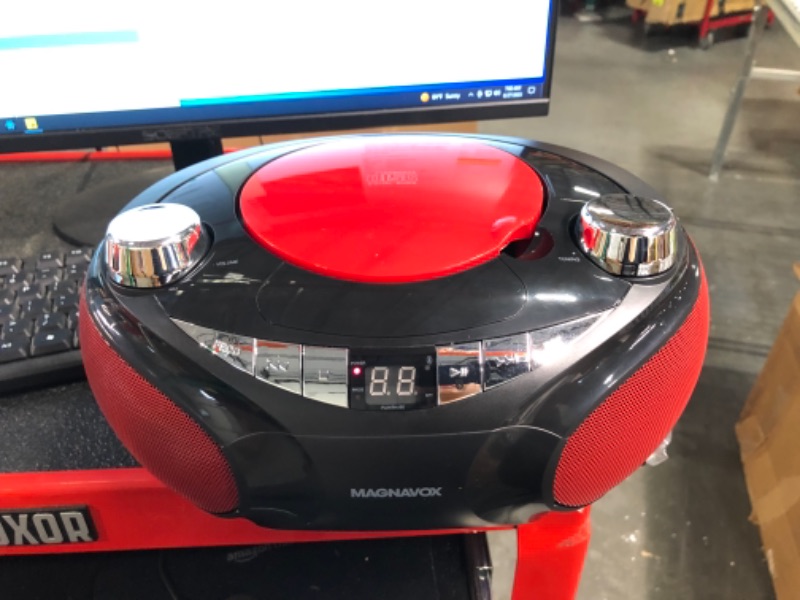 Photo 1 of Magnavox MD6949 Portable Top Loading CD Boombox with AM/FM Stereo Radio and Bluetooth Wireless Technology in Red and Black CD-R/CD-RW Compatible LED Display