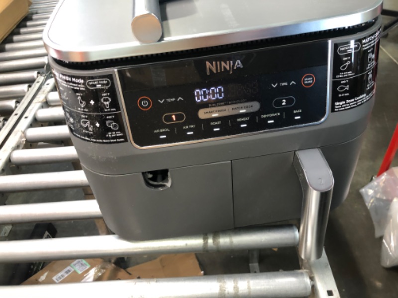 Photo 1 of Ninja DZ201 Foodi 8 Quart 6-in-1 DualZone 2-Basket Air Fryer with 2 Independent Frying Baskets, Match Cook & Smart Finish to Roast, Broil, Dehydrate & More for Quick, Easy Meals, Grey