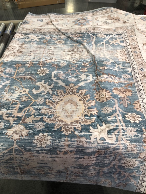 Photo 1 of Area Rug 8' x 10' Blue/white/brown leaves