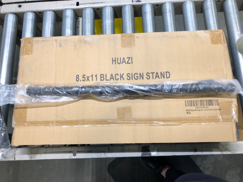 Photo 1 of HUAZI Adjustable Sign Holder Standing Floor Sign Stand for 8.5x11 inches,Both Vertical & Horizontal View Displayed,Snap-Open Frame with Safety Corner for School Church Business Show,Black 8.5 x 11 inches,Black