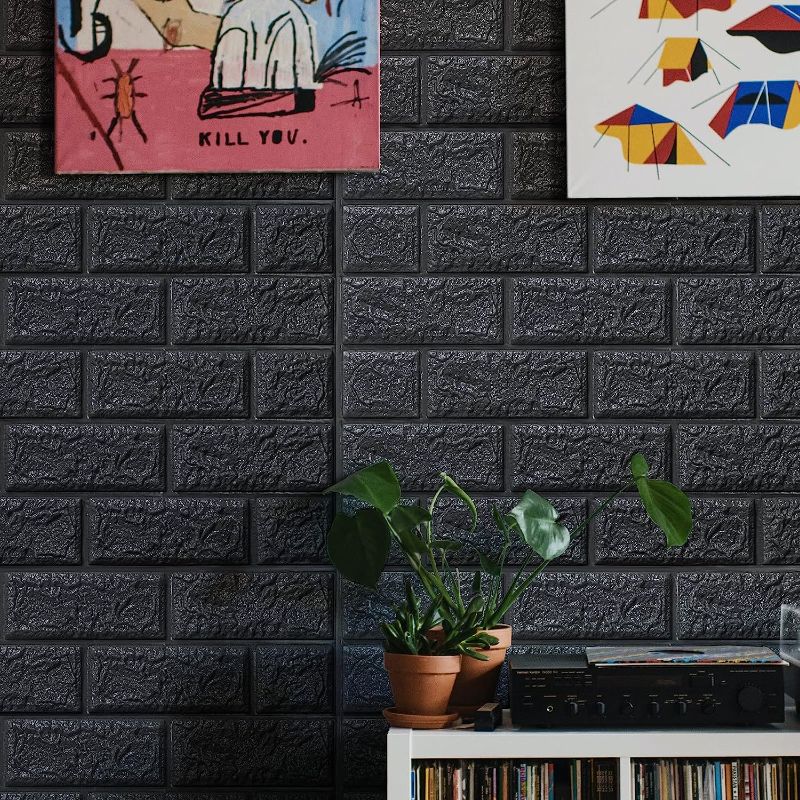 Photo 1 of Brick Wallpaper Peel and Stick, 3D Wall Panels Peel and Stick Waterproof, Self-Adhesive Foam Faux Brick Wall Panels for Bedroom, Bathroom, Kitchen, Fireplace Black