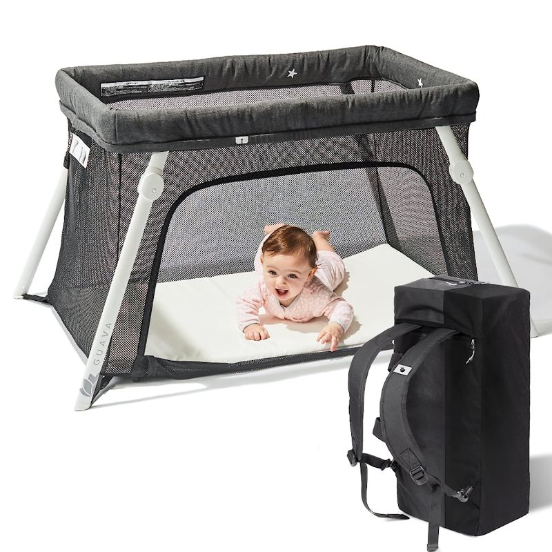 Photo 1 of Lotus Travel Crib - Backpack Portable, Lightweight, Easy to Pack Play-Yard with Comfortable Mattress - Certified Baby Safe