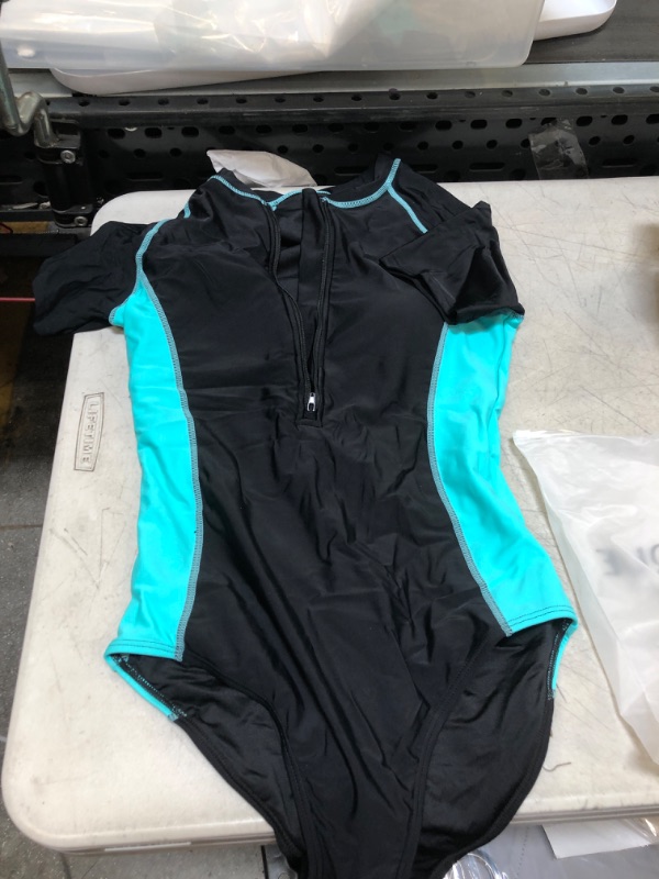 Photo 1 of BLUE AND BLACK ONE PIECE SWIMSUIT ( SIzE: SM ) 