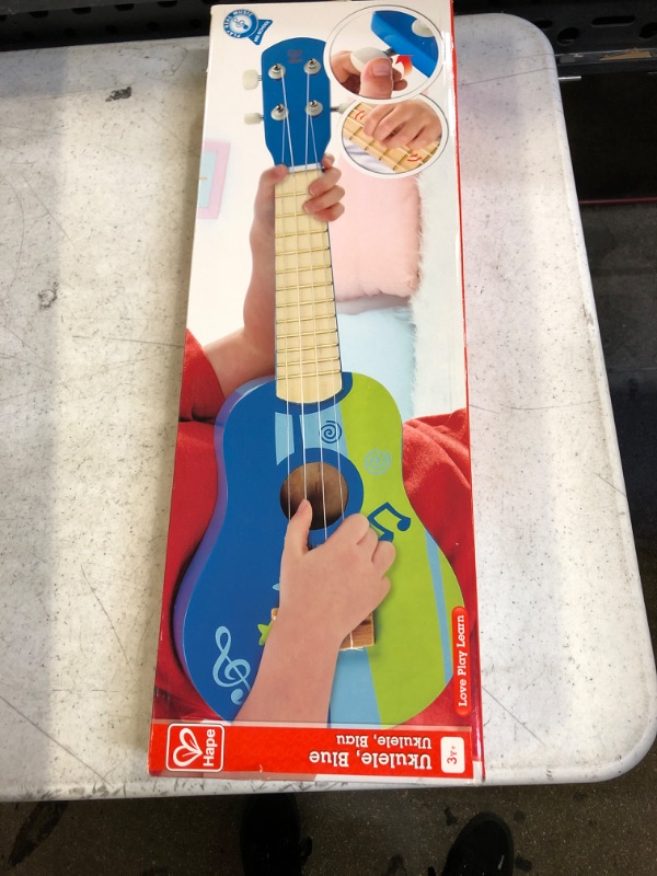 Photo 2 of Hape Kid's Wooden Toy Ukulele in Blue, L: 21.9, W: 8.1, H: 3 inch