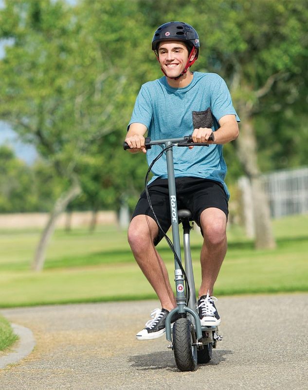 Photo 1 of Razor E300S Seated Electric Scooter for Kids Ages 13+ - 9" Pneumatic Tires, Removable Seat, Up to 15 mph and 40 min of Ride Time, for Riders up to 220 lbs
