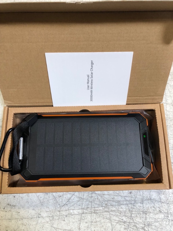 Photo 2 of Solar Charger 30000mAh Qi Wireless Solar Power Bank Built in 2 Cables Portable Charger with LED Flashlight for iOS/Android Cell Phone Tablet and Outdoor Camping for Cell Phone
