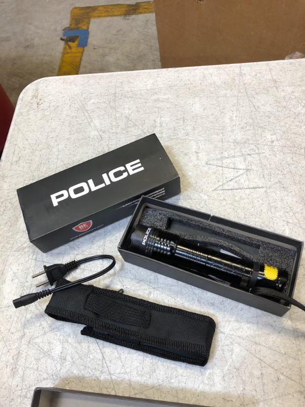 Photo 1 of Small black police flashlight