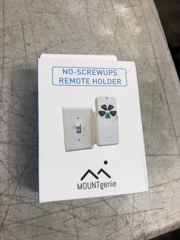 Photo 2 of The No-Screwups Remote Control Holder by Mount Genie (Black): Wall Mount with No Damaging Screws or Tape. Installs in Seconds on Any Light Switch. Great for TV, Ceiling Fan and Roku Remotes.