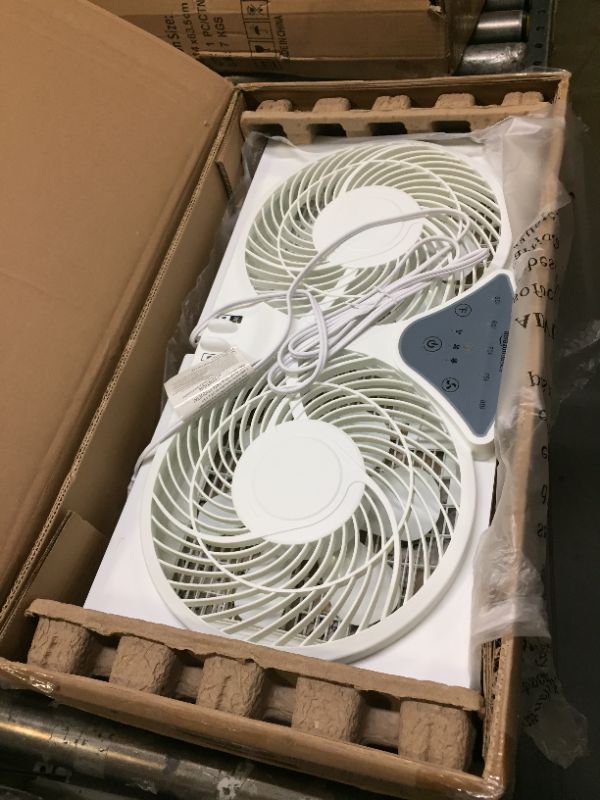 Photo 1 of Amazon Basics Digital Window Fan with Twin 9-Inch Reversible Airflow Blades and Remote Control Digitial Control