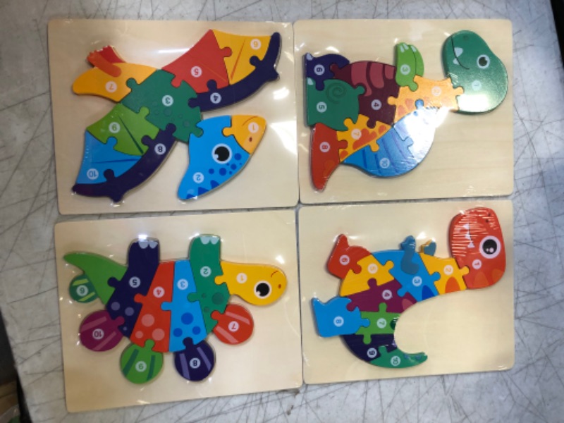 Photo 2 of Dino Puzzles | Fun and Educational Wooden Jigsaw Puzzles for Toddlers 1-3 | 4-Pack with Bright Colors and Interactive 3D Style | Montessori Style Learning Puzzle