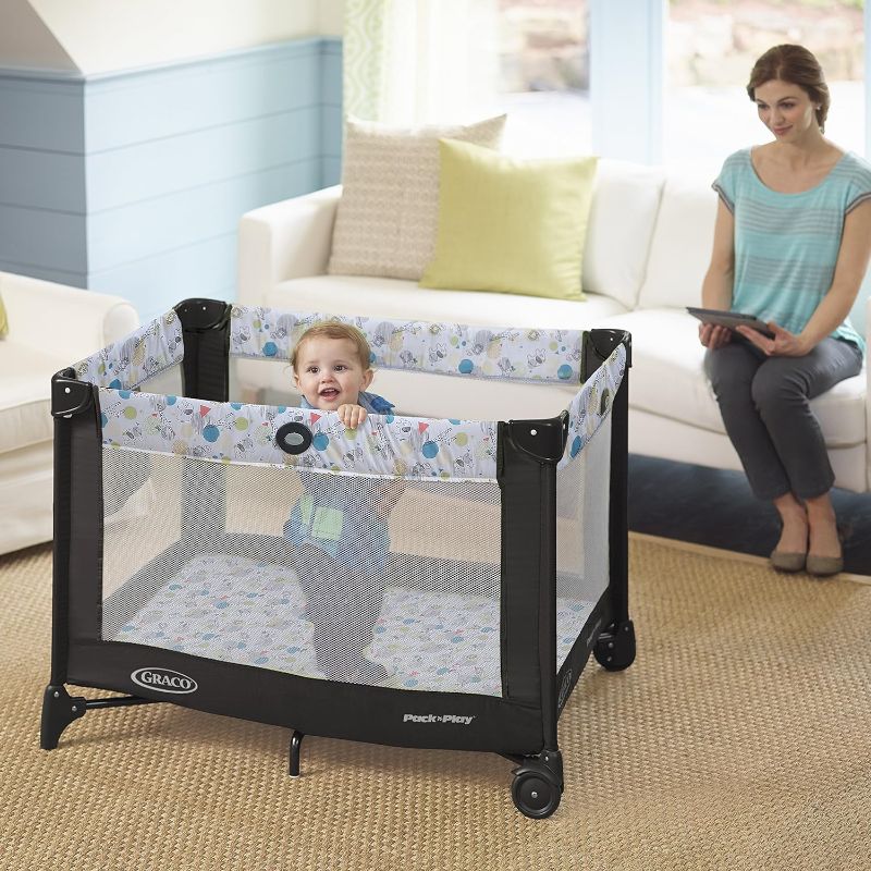 Photo 1 of (READ NOTES) Graco Pack and Play Portable Playard, Push Button Compact Fold, Carnival Portable Playard Carnival