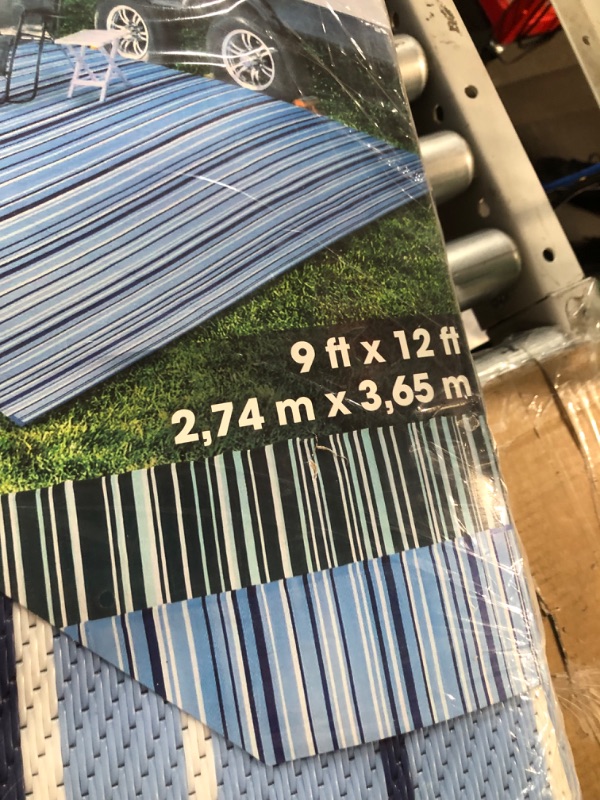 Photo 1 of Camco Outdoor Rug | Features Reversible Blue & White Pattern | Made of Lightweight Breathable Material | Measures 9’ x 12’