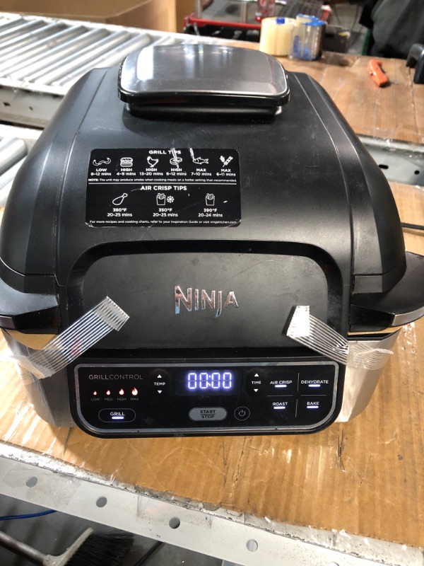 Photo 2 of **MINOR DAMAGE** Ninja AG301 Foodi 5-in-1 Indoor Grill with Air Fry, Roast, Bake & Dehydrate, Black/Silver Black/Silver 4-Quart Indoor Grill