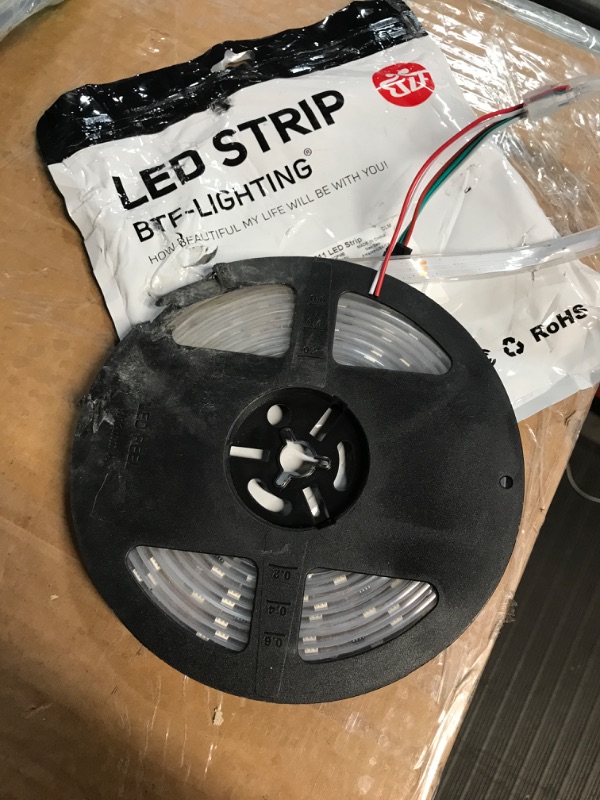 Photo 1 of WS2812b LED Strip,16.4ft Individually Addressible FCB LED Lights, 300 Pixel Digital Programmable LED Strip Lights with Chase Effect,