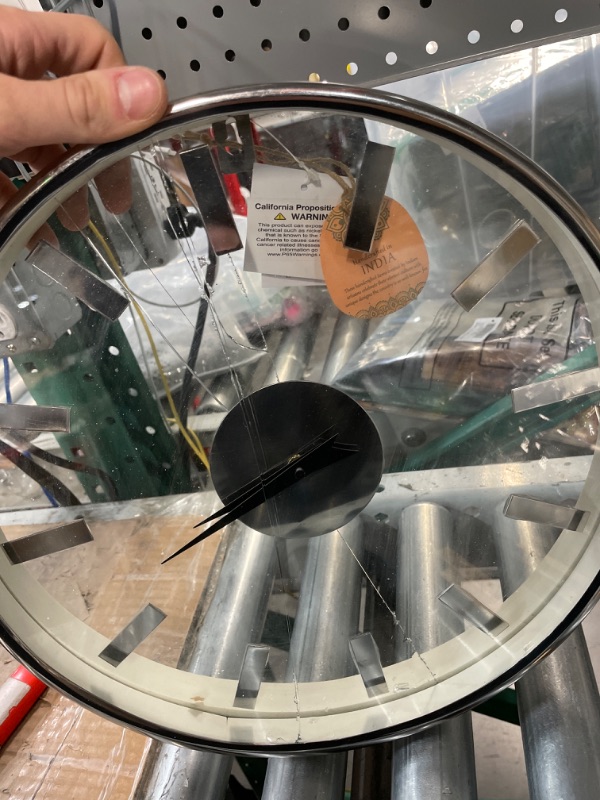 Photo 1 of *BROKEN* Deco 79 Aluminum Wall Clock with Clear Face, 14" x 2" x 14", Silver