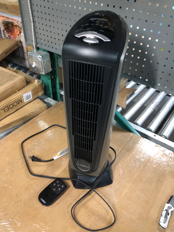 Photo 3 of ***FOR PARTS ONLY****READ NOTES**
Lasko Oscillating Ceramic Tower Space Heater for Home with Adjustable Thermostat, Timer and Remote Control, 22.5 Inches, Grey/Black, 1500W, 751320