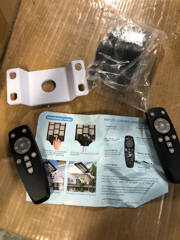 Photo 1 of 
1000W Solar Street Lights Outdoor, Motion Sensor Led Solar Outdoor Lights with Remote Control & Arm Pole, 7000K 100000LM IP66 Waterproof Dusk to Dawn Solar LED Lights Lamp for Garden Yard
