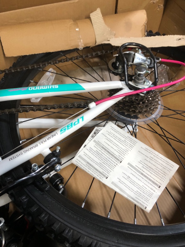 Photo 2 of Dynacraft Vertical Dual Suspension Mountain Bike Girls 24 Inch Wheels with 18 Speed Grip Shiter and Dual Hand Brakes in Teal and Pink