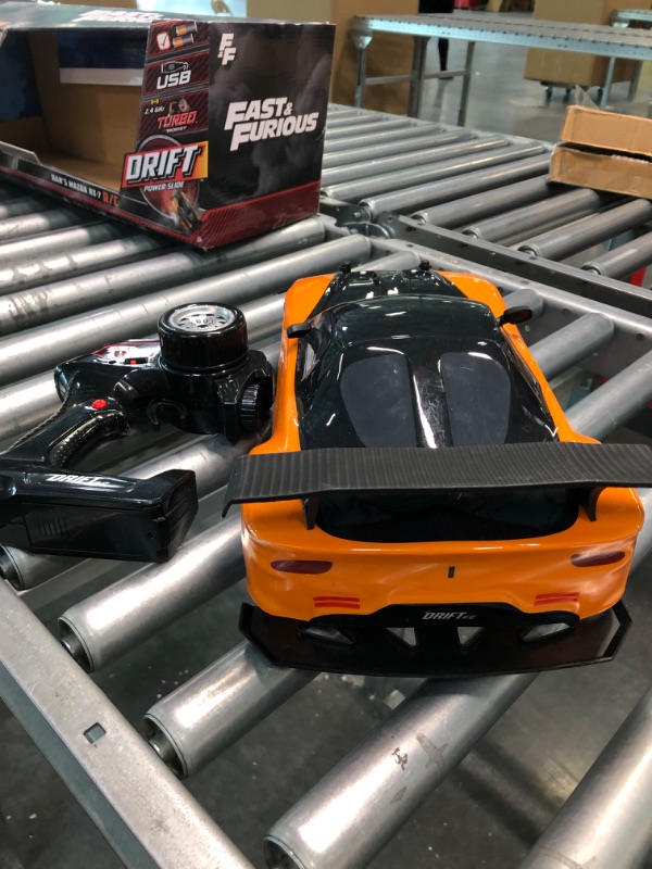 Photo 5 of Jada Toys Fast & Furious Han’s Mazda RX-7 Drift RC Car, 1: 10 Scale 2.4Ghz Remote Control Orange & Black, Ready to Run, USB Charging (Standard) (99700)