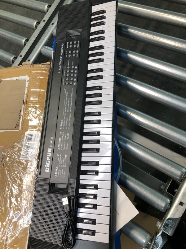 Photo 1 of Kids Piano 61 Keys Music Keyboard forKids Portable Piano Keyboard with Microphone Electronic Musical Instruments for Kids Music Learning Toys for 3 4 5 6 Year Old Boys Girls Gifts 24.4*6*2 inches Black