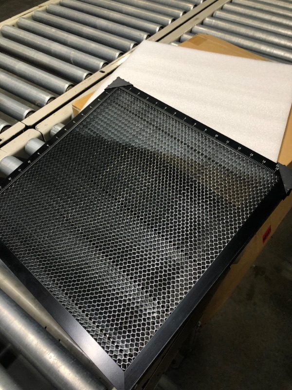 Photo 1 of honeycomb working panel with engraving materials 