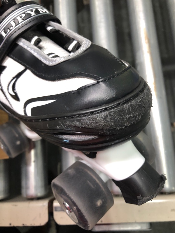 Photo 1 of roller skates black and white 